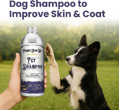 Dog shampoo bottle held by a hand with a dog in the background, outdoors.