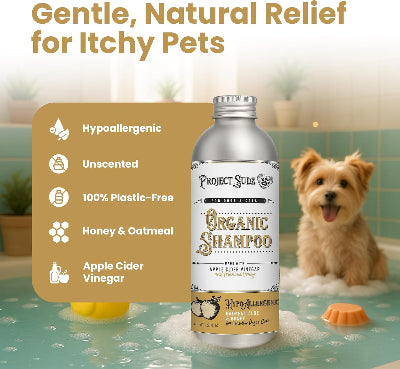Project Sudz Organic Shampoo bottle for hypoallergenic pets, shown in a bathroom scene with a small dog in a bubble bath. The left side features a tan informational panel detailing product benefits like hypoallergenic and unscented.