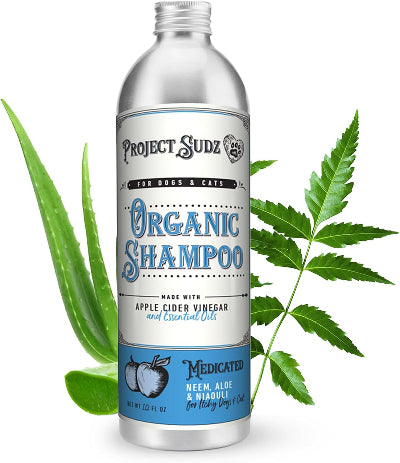 A bottle of Project Sudz Organic Shampoo for dogs and cats, styled with aloe vera on a clean white background.