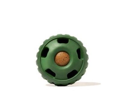 A green Pupsicle dog toy with a treat inside, designed for interactive play.