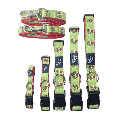 Set of dog collars and leashes with festive Grinch design on a white background