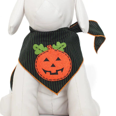 A black pinstriped pet bandana with an orange pumpkin applique and green leaves, shown on a white dog mannequin.