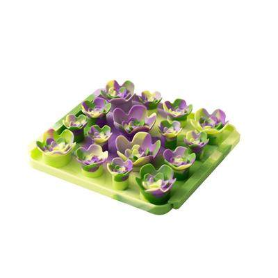 Green and purple egg-shaped mold on a white background