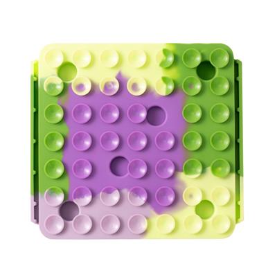 Colorful suction cups with a gradient from green to purple on a white background