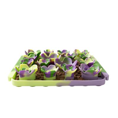 Pet foraging mat with green and purple silicone flowers on a white background