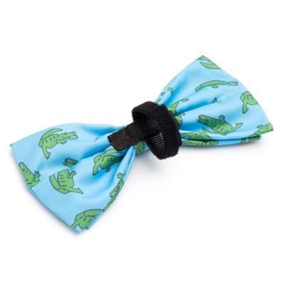 Blue cat or dog bow tie with green alligators on white background with velcro closure that fits around collar
