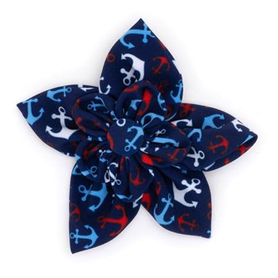 Navy blue flower-shaped hair bow with anchor pattern on a white background