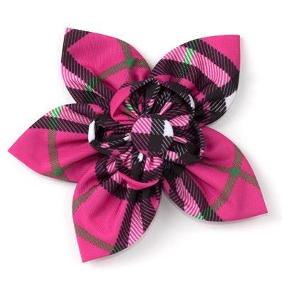 Pink and black plaid bow on a white background