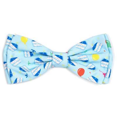 Colorful bow tie with cartoon designs on a light blue background