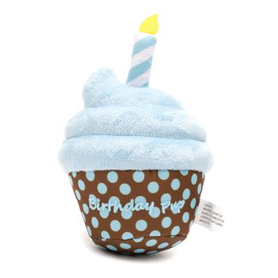 Blue dog cupcake toy with candle with brown base and blue polka dots.