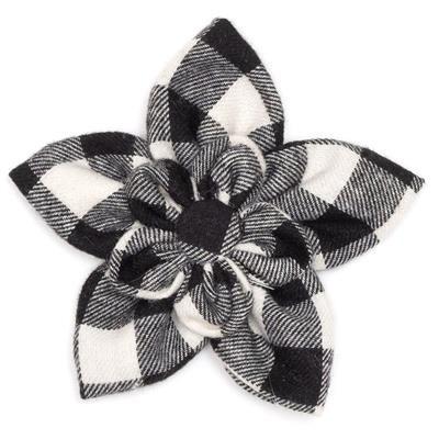 Black and white checkered flower-shaped object on a white background