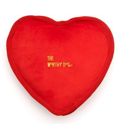 Red heart-shaped pillow with 'The Worthy Dog' branding on a white background