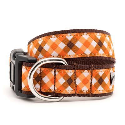 Dog collar with orange and brown checkered pattern on a white background