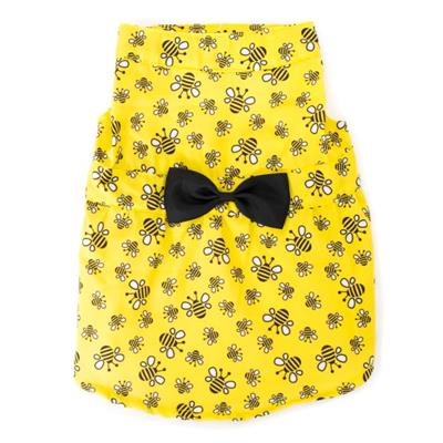 Yellow pet dress with bee pattern and black bow tie on a white background