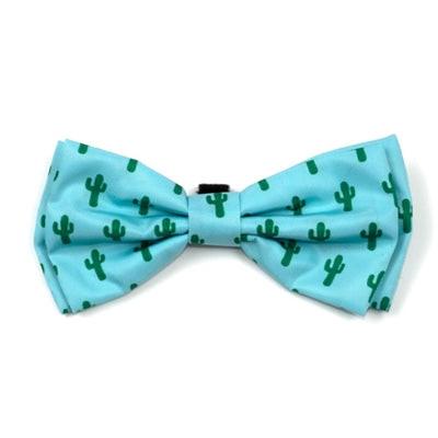 Light blue bow tie with green cactus pattern on a white background