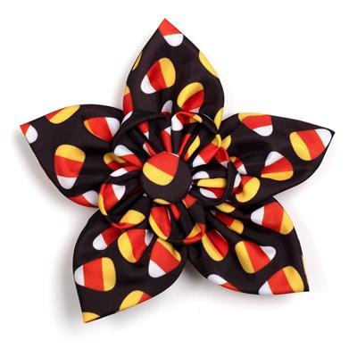 Large fabric flower with candy corn pattern on a white background