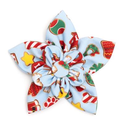 Colorful fabric flower with Christmas-themed patterns on a white background