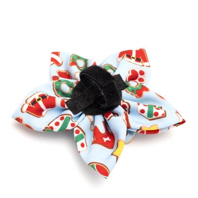 Colorful fabric flower with a black center on a white background