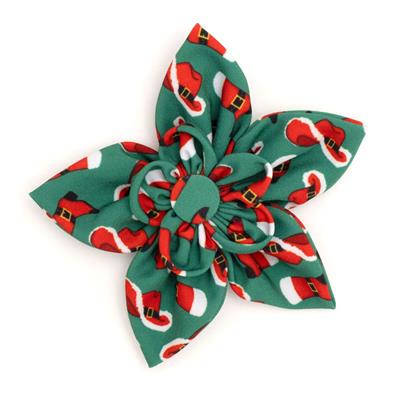 Christmas-themed flower-shaped collar accessory with red and green design on a white background