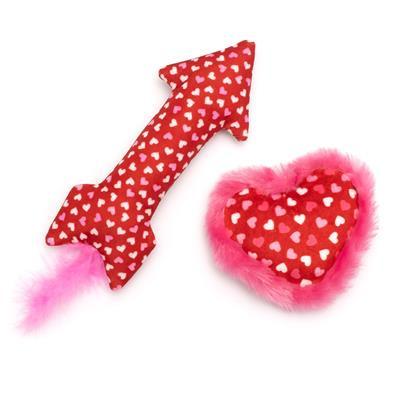 Red and pink heart-shaped toy with a white polka dot pattern on a white background