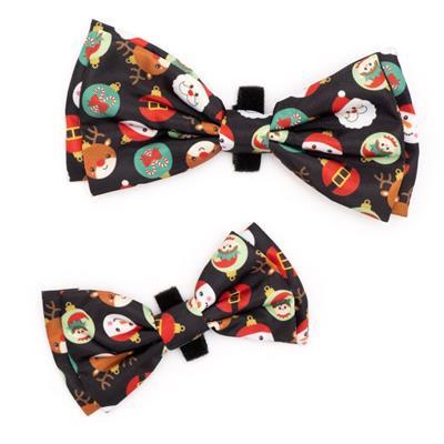 Two Christmas-themed bow ties on a white background