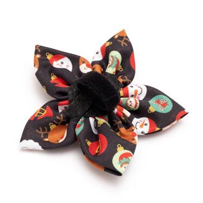 Christmas-themed hair bow with reindeer, snowmen, and presents on a black background.