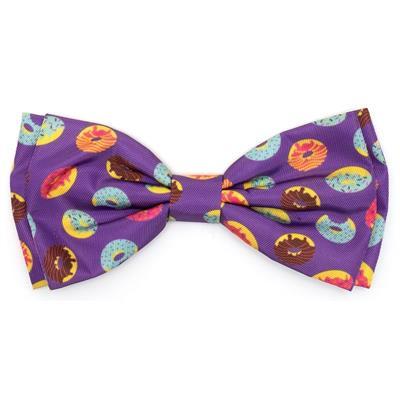 Purple bow tie with colorful donut pattern on a white background