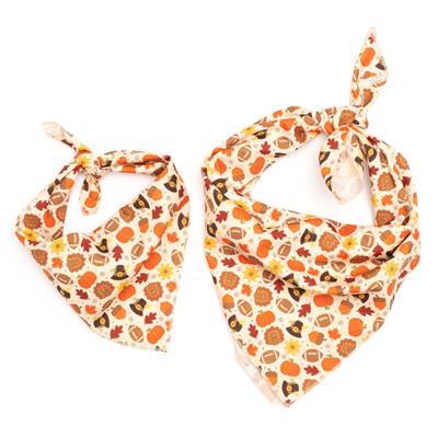 Two bandanas with autumn-themed patterns on a white background