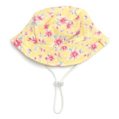 Yellow floral bucket hat with a white strap on a white background