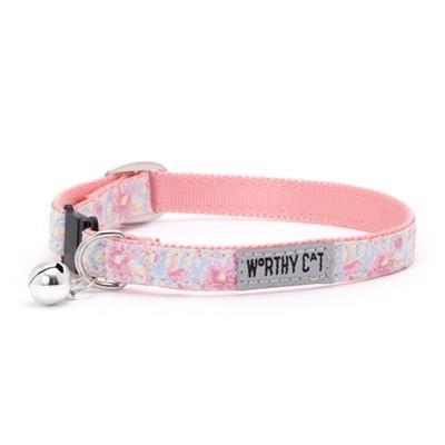 Floral patterned cat collar with a bell and 'Worthy Cat' tag on a white background