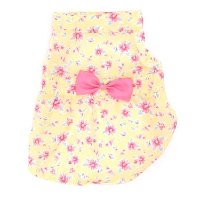 Yellow dog dress with pink flowers and pink bow on white background