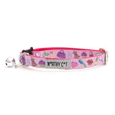 Pink cat collar with colorful designs and bell on white background.