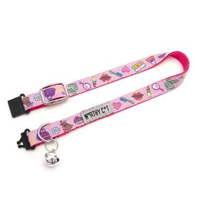 Pink breakaway cat collar with colorful designs and bell on white background.