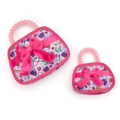 Two heart-shaped pet toys with pink bows on a white background