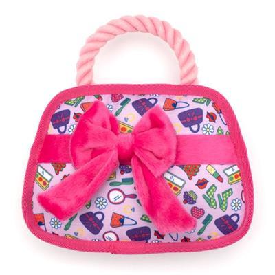 Dog toy with colorful patterned cover and pink bow on a white background