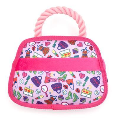 Colorful patterned bag with pink handle on a white background