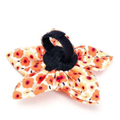 Floral collar flower with black Velcro closure on a white background