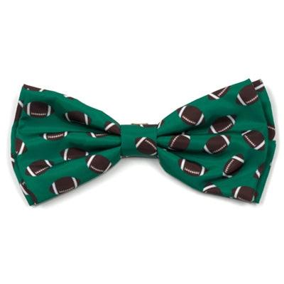 Green dog bow tie with football pattern on white background