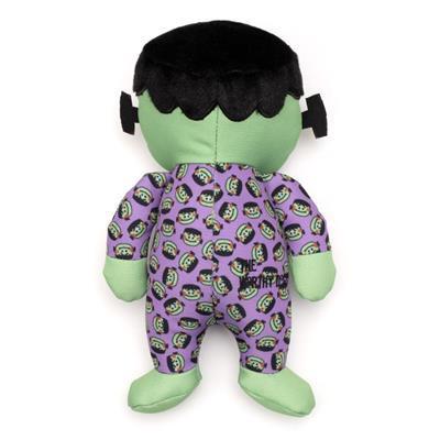 Plush toy resembling a character with green skin and purple outfit on a white background