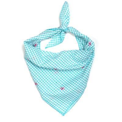 A blue and white gingham tie bandana with embroidered flamingo graphics designed for pets.