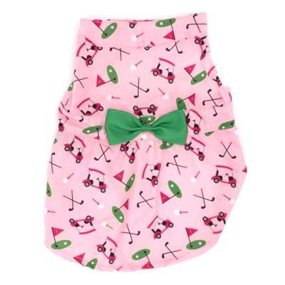 Pink dog dress with golf-themed design and green bow on a white background