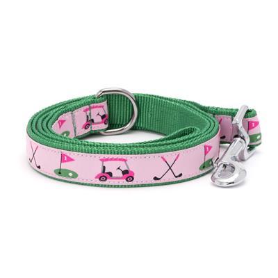 A pink adjustable dog collar with a pink golf-themed pattern, featuring woven ribbon and a snap clasp.