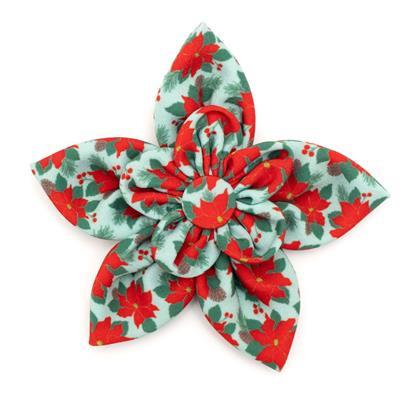 Red & green dog collar flower with poinsettia themed pattern on white background.