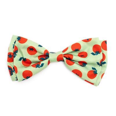 Green bow tie with tomato pattern on white background
