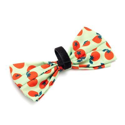 Green bow tie with tomato pattern and Velcro closure on white background
