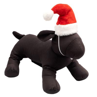 Black dog plush toy wearing a red Santa hat on a white background