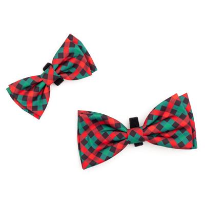 Two red and green plaid bow ties on a white background