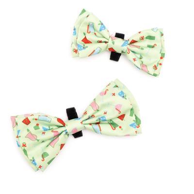 Two colorful bow ties with a pattern on a white background