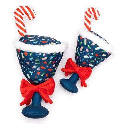 Two blue dog toys shaped like cocktail glasses with cocktail patterns, candy cane and red bow on white background