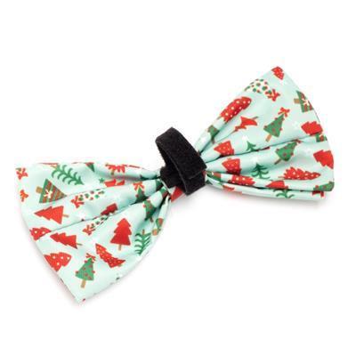 Christmas-themed bow tie with trees and presents on a white background